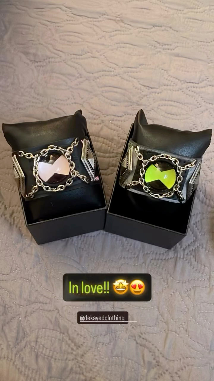 2 ben 10 omnitrix bracelet with a green and white variation.