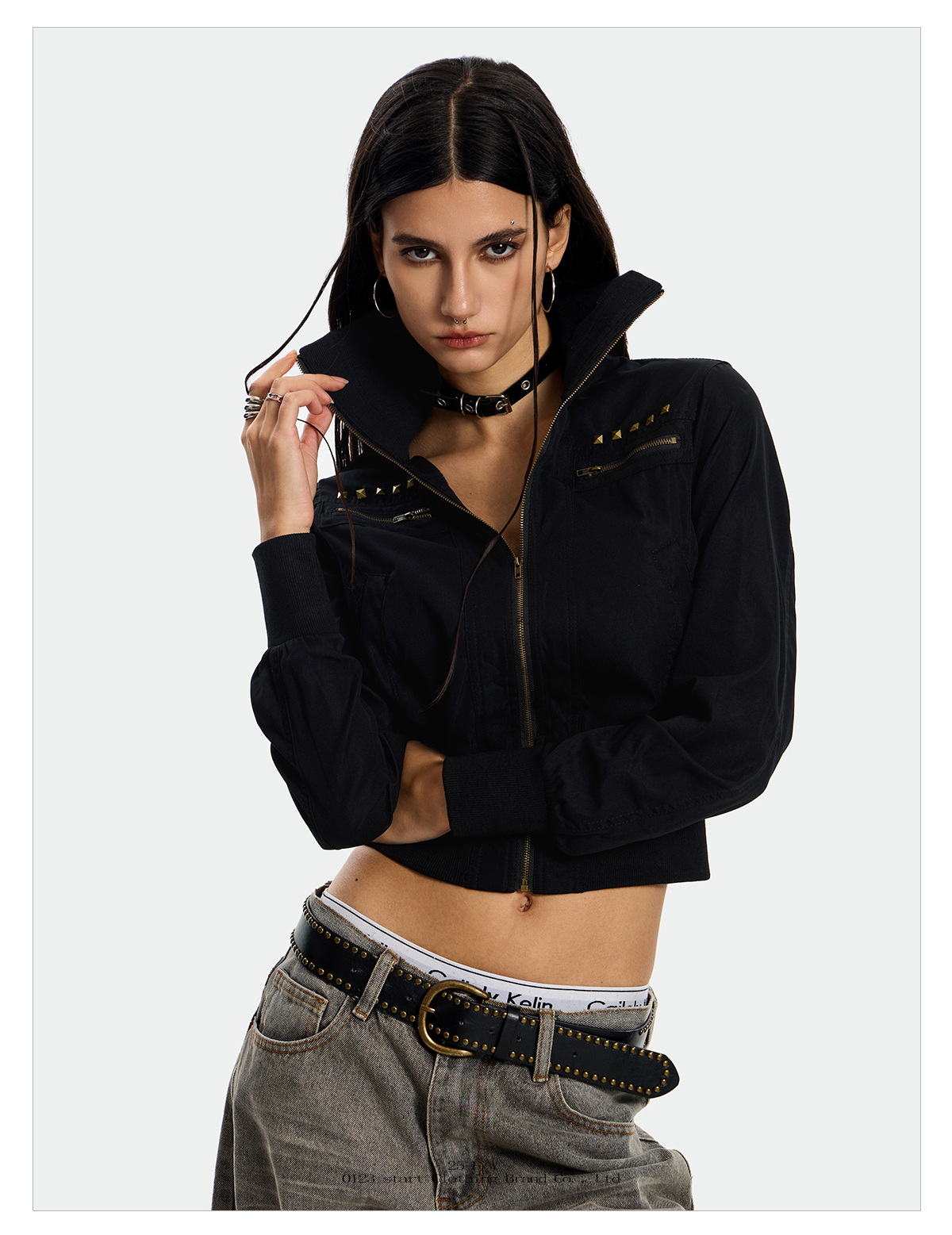 A model is shown in two poses wearing a black Rebel Camo Jacket with studded detailing.