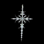 A brilliant WHITE GOLD APOSTLE NECKLACE pendant, intricately designed with a central gem and sparkling diamonds, is showcased against a dark background.