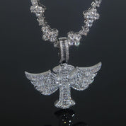 A gleaming Winged Angel Zircon Diamond Necklace, featuring a large, intricate winged angel pendant, sparkles against a dark, reflective surface.