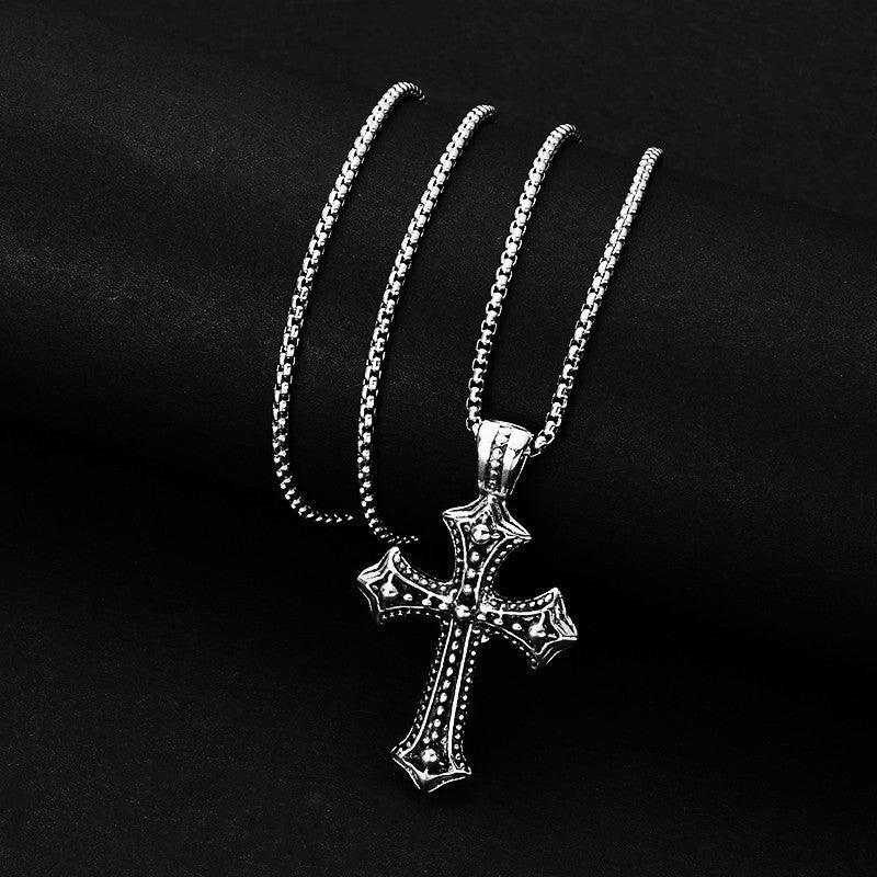 camo cross necklace being rolled.