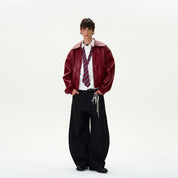 a model standing wearing red leather jacket vintage.