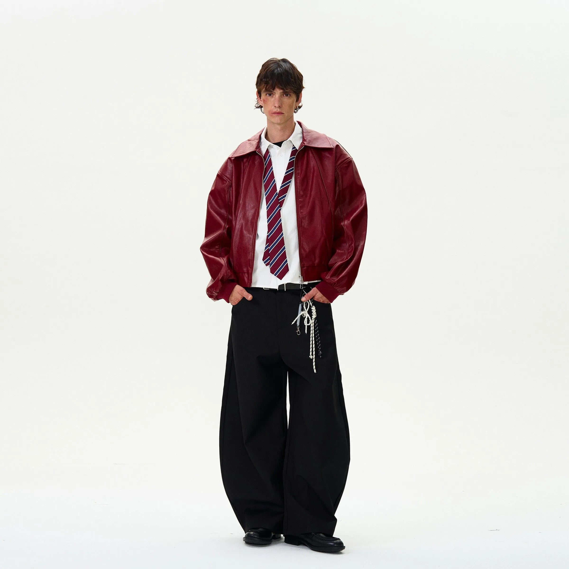 a model standing wearing red leather jacket vintage.