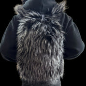 A fluffy dark grey Plush Backpacks - Lost Series with bunny ears are shown on a person's back in two separate images, highlighting their playful designs.