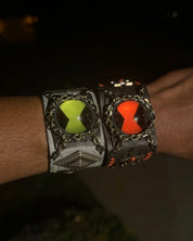 Green and red omnitrix bracelet.