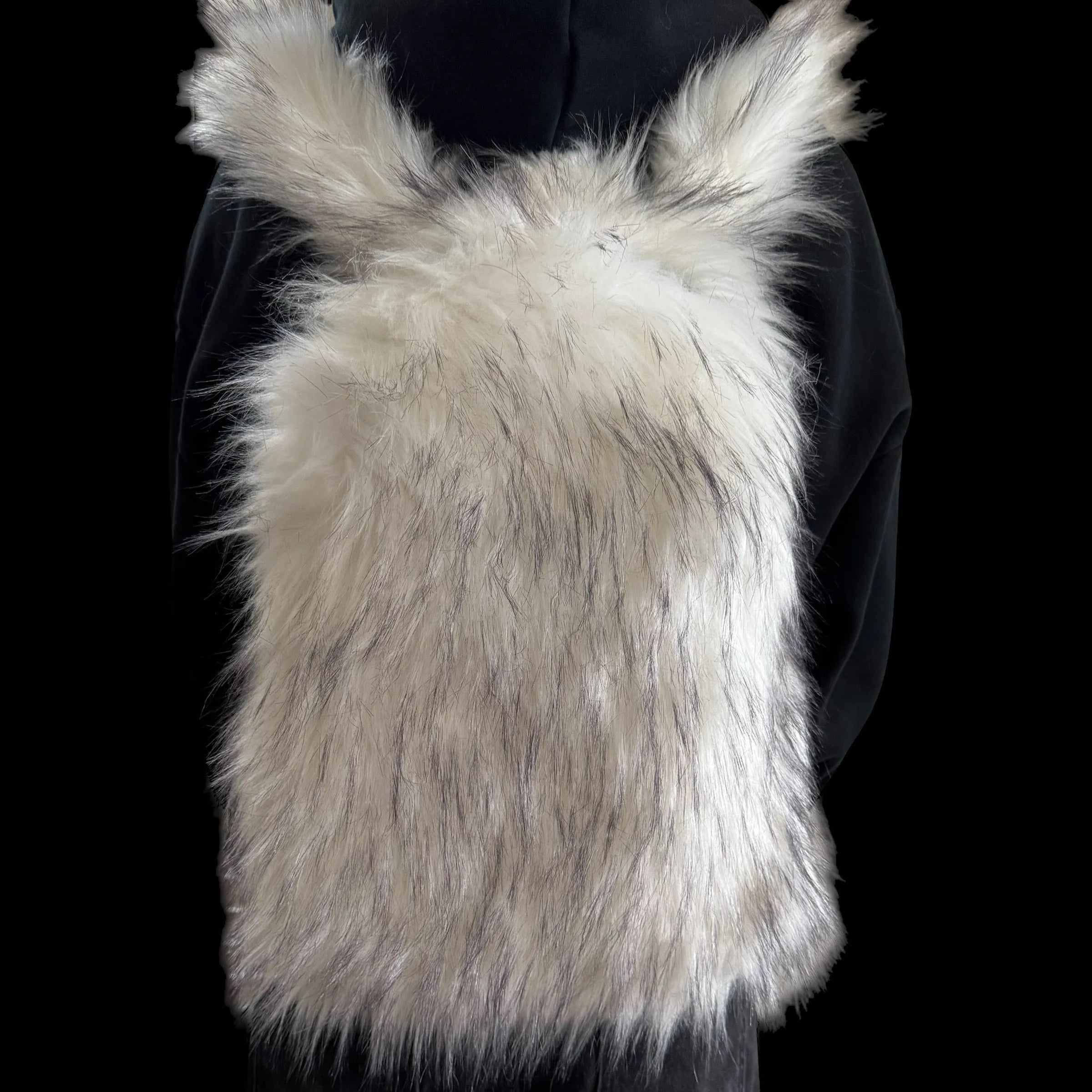 A luxurious white and grey fluffy Plush Backpacks - Lost Series is worn on a person's back, set against a dark background, perfectly blending playful design.