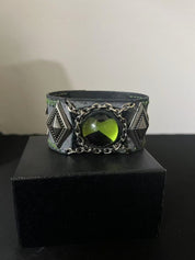 green ben 10 omnitrix displayed in a black box.
