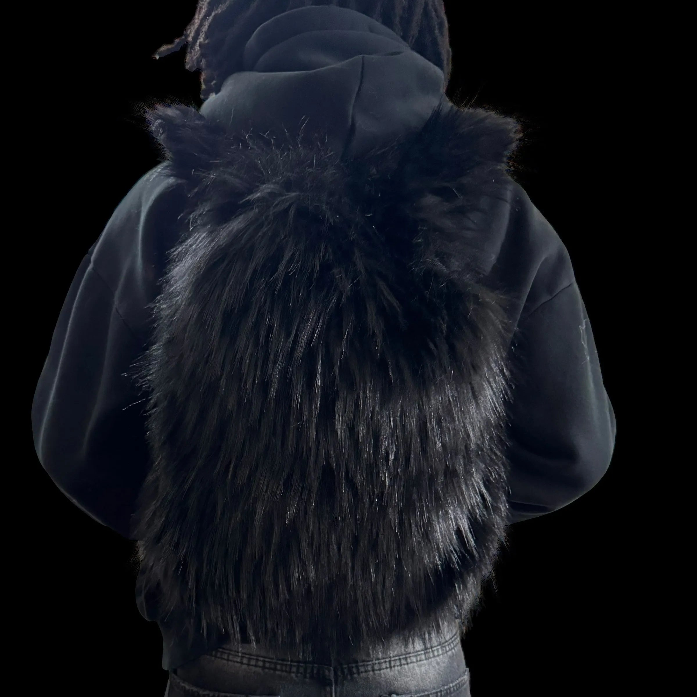 A plush black Plush Backpacks - Lost Series with a sleek, dark finish and playful ears is worn on a person's back, set against a dark background.