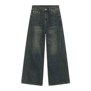 Full-length shot of dark washed wide leg jeans.
