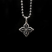 NightMelody GothRite Necklace, a striking silver pendant featuring an intricate quatrefoil design on a delicate ball chain.