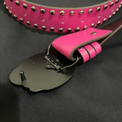 The reverse side of a ninja turtle buckle is shown, revealing its black metal fastening mechanism.