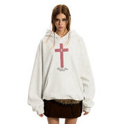 A wman with  GOTHIC HOODIE with a red cross design.