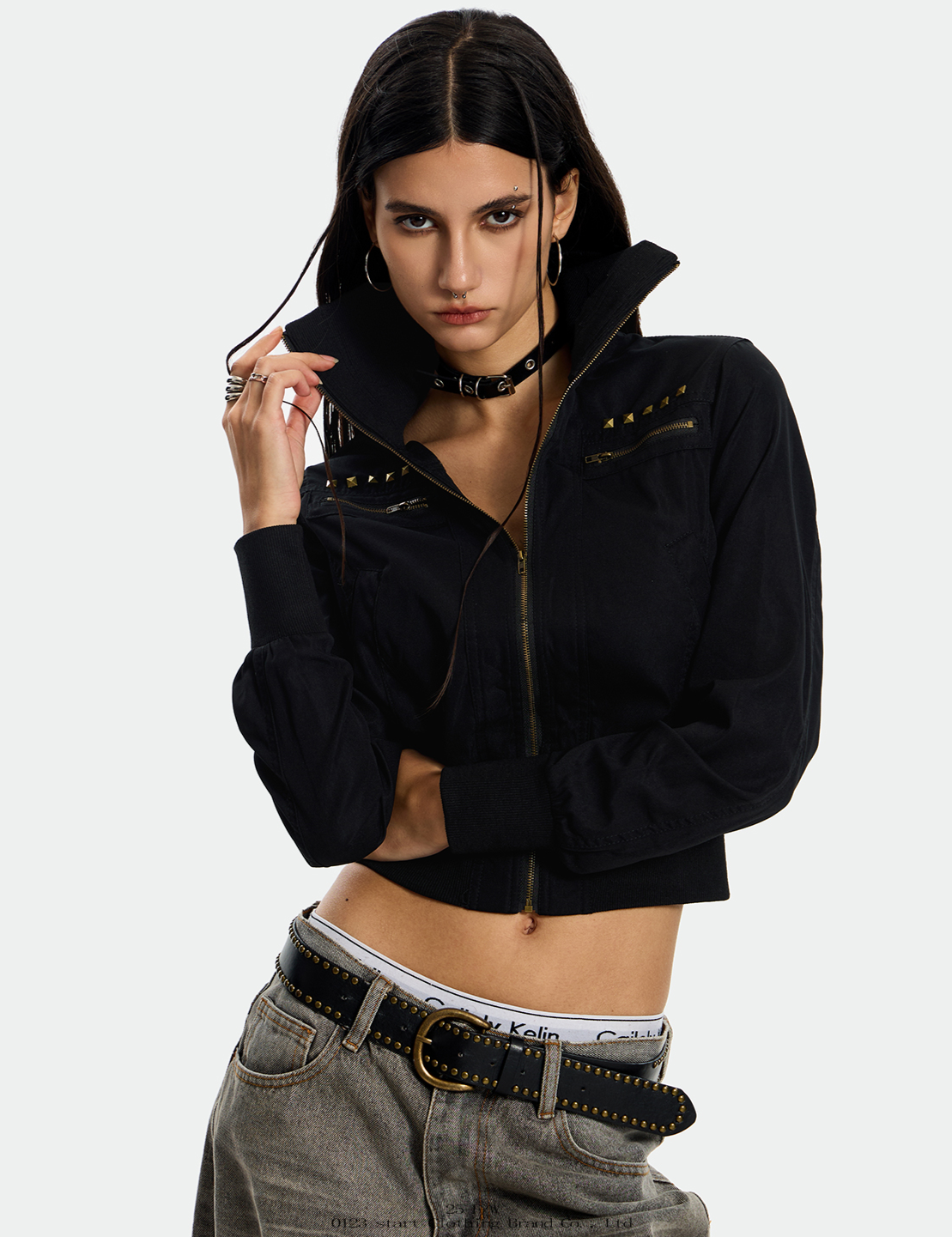 A model is shown in two poses wearing a black Rebel Camo Jacket with studded detailing.