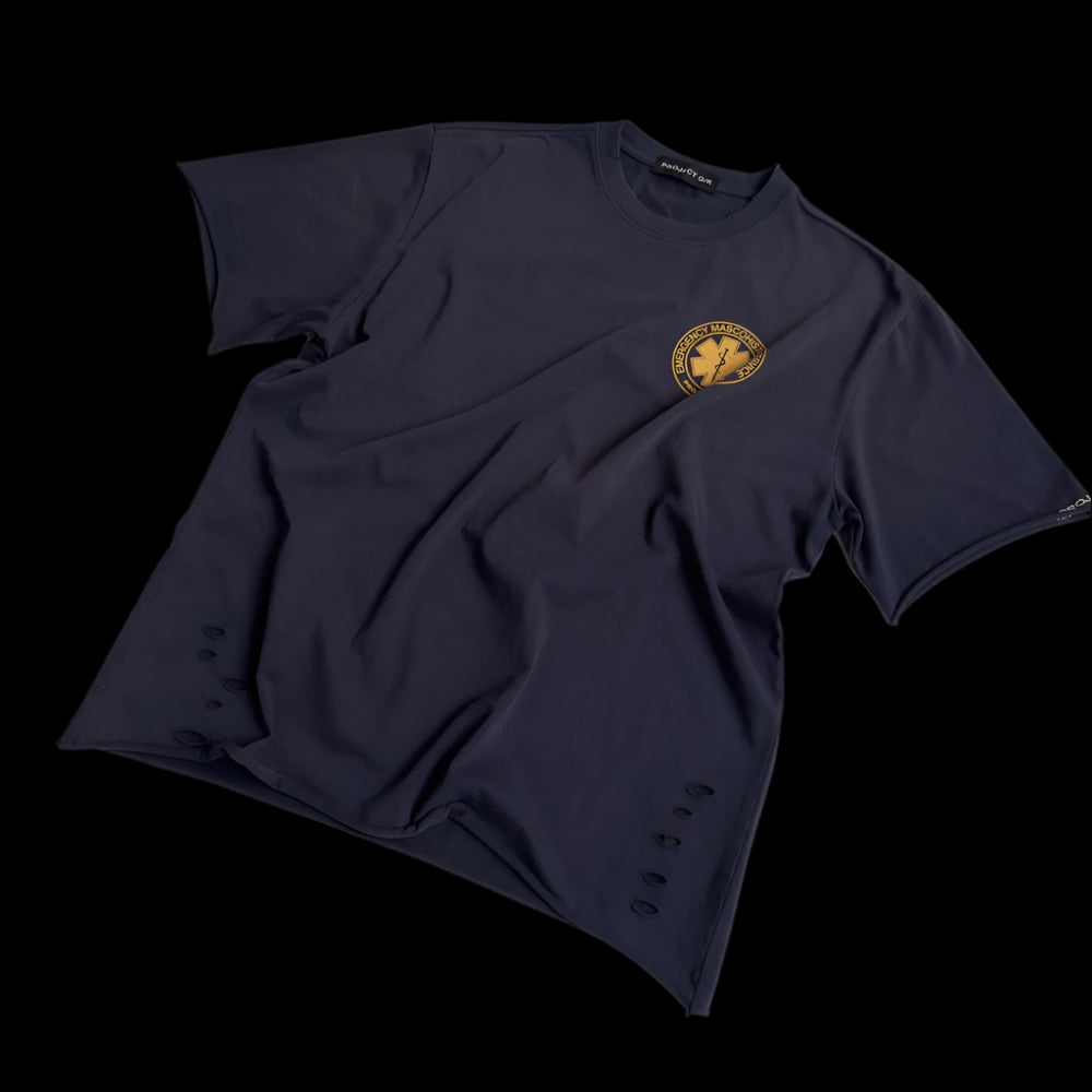 Slightly angled "Masochist DIVISION TEE" featuring a gold circular emblem with a star of life symbol and text on the front, with distressed details.