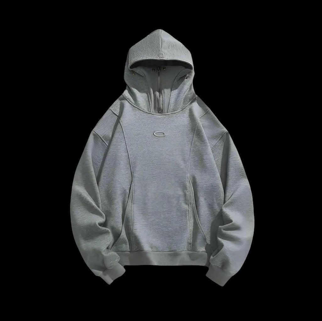 A plain gray masked hoodie with a zipper is shown from dekayed clothing store.