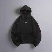 A plain black masked hoodie with a zipper is shown against a white background.