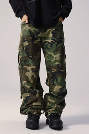 A man wearing dark Vintage Camouflage Cargo Pants.
