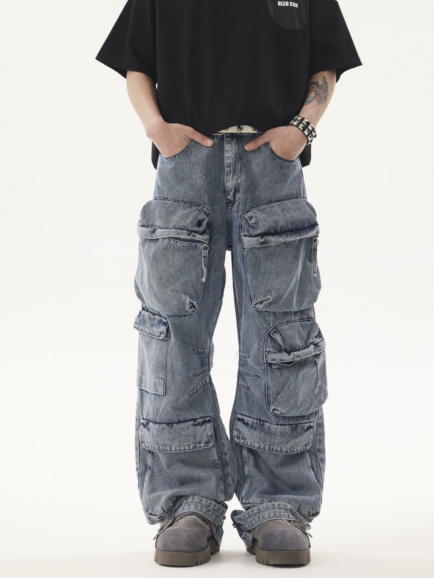A person wears a black t-shirt and light blue, acid-wash Heavy duty Vibe Cargo Jeans with multiple large pockets, paired with grey platform sneakers.