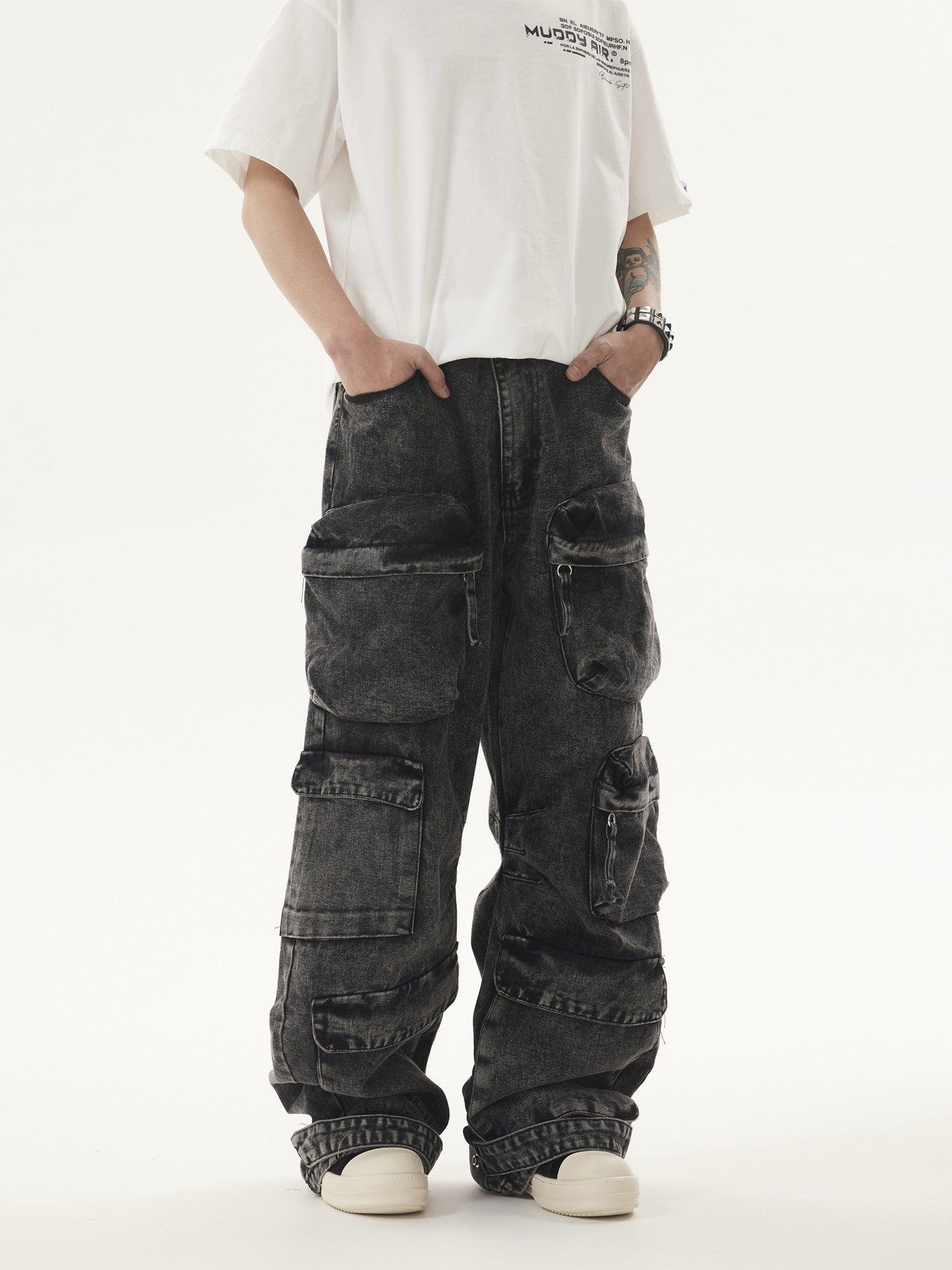 A person stands with hands in the pockets of dark, acid-wash Heavy duty Vibe Cargo Jeans featuring multiple cargo pockets, paired with a white t-shirt and white sneakers.