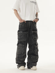 A person stands with hands in the pockets of dark, acid-wash Heavy duty Vibe Cargo Jeans featuring multiple cargo pockets, paired with a white t-shirt and white sneakers.