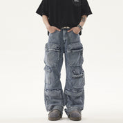 A person wears a black t-shirt and light blue, acid-wash Heavy duty Vibe Cargo Jeans with multiple large pockets, paired with grey platform sneakers.
