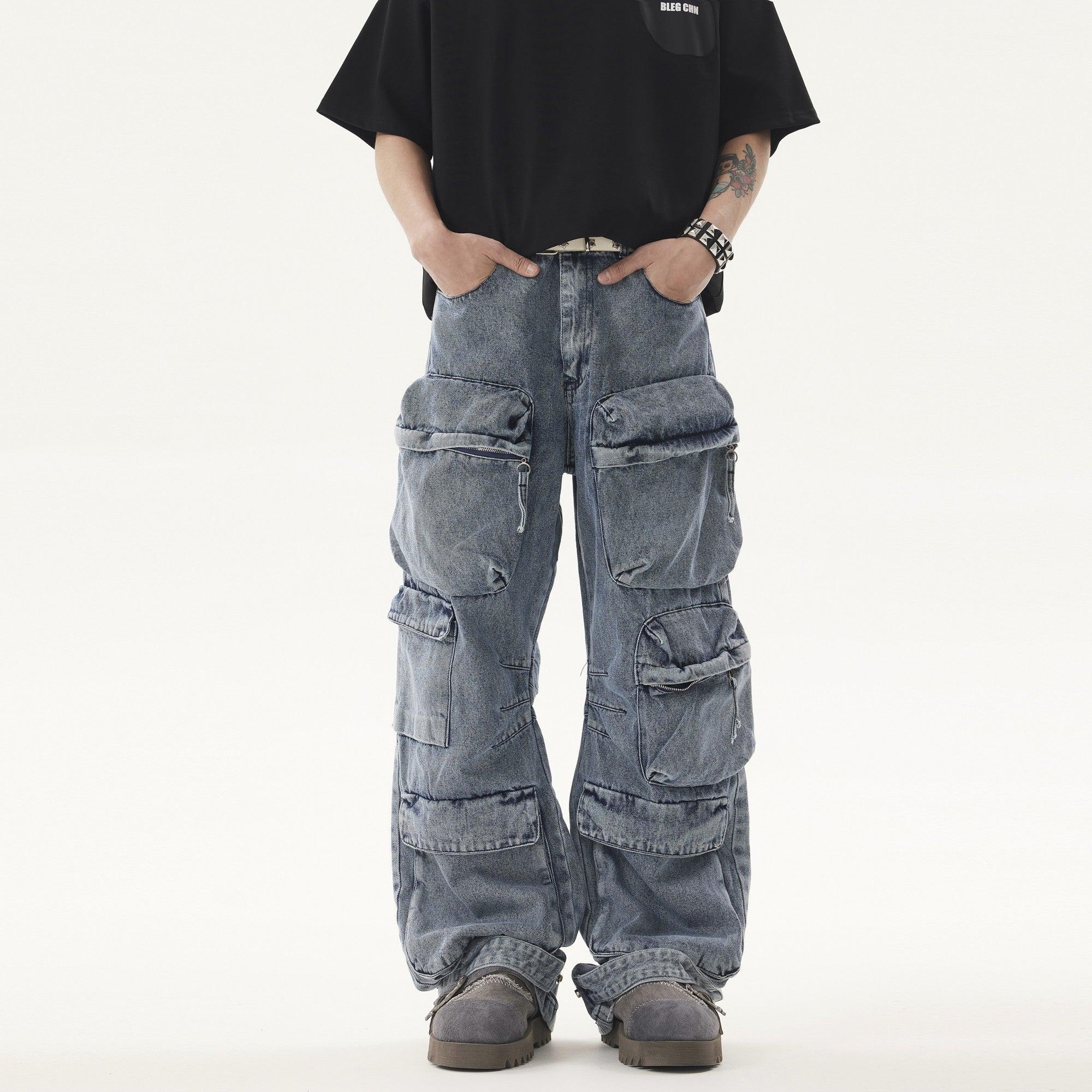 A person wears a black t-shirt and light blue, acid-wash Heavy duty Vibe Cargo Jeans with multiple large pockets, paired with grey platform sneakers.