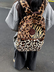 Showing a woman Multi Leopard Print Plush Backpack.