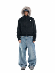 A person models a black "mens hooded faux fur jacket" with a grey faux fur-trimmed hood.