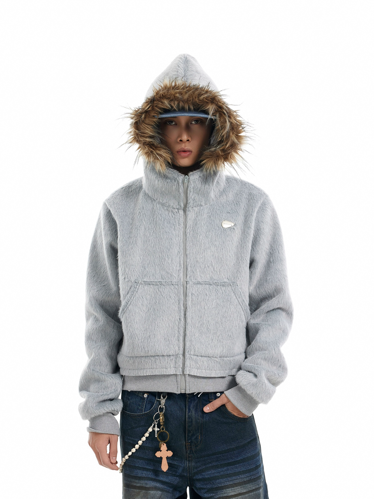 A person models a light grey "mens hooded faux fur jacket" featuring a prominent brown faux fur hood.