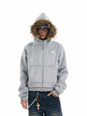 A person models a light grey "mens hooded faux fur jacket" featuring a prominent brown faux fur hood.
