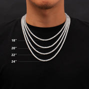 A person wears four layered diamond tennis chains of varying lengths (18", 20", 22", 24"), illustrating different necklace sizes.