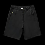 A black pair of Remedy Straight Workwear Mid-Length Jorts is displayed flat against a dark background, featuring subtle yellow stitching on the coin pocket, a button fly, and two large front pockets.