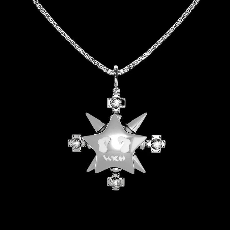 A shiny "VSCH Lucky Star Necklace" with a star pendant and diamond cross accents hangs on a silver chain against a black background.
