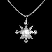 A shiny "VSCH Lucky Star Necklace" with a star pendant and diamond cross accents hangs on a silver chain against a black background.
