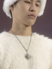 A person with a serious expression and a white fuzzy hat wears a "VSCH Lucky Star Necklace" with a star pendant, visible against their fluffy white sweater.